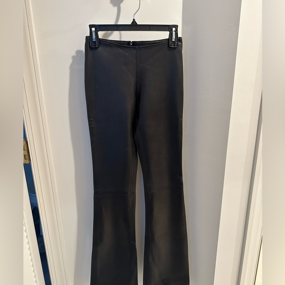 Brand new, lined calves leather pants, with the zipper in the back! Never worn.